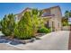 Charming two-story home features a red tile roof, neat landscaping, and a concrete driveway at 7917 Sally Irene Ct, Las Vegas, NV 89113