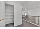 Hallway with a walk in closet by railing overlooking a staircase at 7917 Sally Irene Ct, Las Vegas, NV 89113