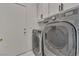 Well-equipped laundry room with modern washer and dryer units at 7917 Sally Irene Ct, Las Vegas, NV 89113