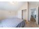 Bedroom featuring vaulted ceilings and a closet with sliding doors at 792 Valley Rise Dr, Henderson, NV 89052