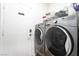 Well-equipped laundry room with modern washer and dryer appliances at 792 Valley Rise Dr, Henderson, NV 89052