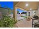 Covered patio with grill area and outdoor seating, complemented by a paved backyard and mature landscaping at 796 Keys View Ave, Las Vegas, NV 89138