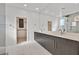 Bright bathroom featuring double sinks, a large mirror, and a glass shower with modern fixtures at 796 Keys View Ave, Las Vegas, NV 89138