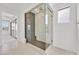 Modern bathroom featuring a glass-enclosed shower with stylish fixtures and tile work at 796 Keys View Ave, Las Vegas, NV 89138