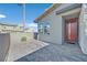 Charming home exterior featuring a red front door and paved entryway at 796 Keys View Ave, Las Vegas, NV 89138