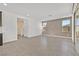 Spacious living room featuring tile flooring and sliding glass doors at 796 Keys View Ave, Las Vegas, NV 89138