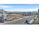 Neighborhood street view showcasing modern homes with mountain views in the distance, under a clear blue sky at 796 Keys View Ave, Las Vegas, NV 89138