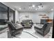 Sleek bar area with a sink, mini-refrigerator, and custom shelving at 801 Dragons Eye Dr, Henderson, NV 89012