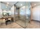 Luxurious bathroom featuring a glass-enclosed shower, vanity and tiled floors at 801 Dragons Eye Dr, Henderson, NV 89012