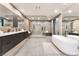 Contemporary bathroom featuring a soaking tub, glass shower, and dual sink vanity at 801 Dragons Eye Dr, Henderson, NV 89012