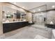 Sleek bathroom featuring a double vanity, large frameless glass shower, and elegant finishes for a spa-like experience at 801 Dragons Eye Dr, Henderson, NV 89012