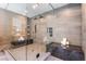 Modern bathroom boasts a large glass shower with dual shower heads and tiled walls at 801 Dragons Eye Dr, Henderson, NV 89012