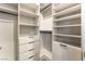 Spacious walk-in closet with custom shelving and drawers for optimal organization at 801 Dragons Eye Dr, Henderson, NV 89012