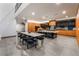 Spacious dining area featuring modern table, seating for eight, and contemporary lighting fixtures at 801 Dragons Eye Dr, Henderson, NV 89012