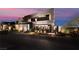 Stylish modern home exterior featuring unique architectural details, lush landscaping, and a welcoming entrance at 801 Dragons Eye Dr, Henderson, NV 89012