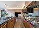 Sleek, modern kitchen featuring stainless steel appliances and beautiful wood cabinetry at 801 Dragons Eye Dr, Henderson, NV 89012