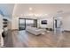 Bright and airy living room with a sliding glass door and sleek furnishings at 801 Dragons Eye Dr, Henderson, NV 89012