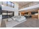 Spacious living room with two story ceilings, view to kitchen, and ample natural light at 801 Dragons Eye Dr, Henderson, NV 89012