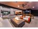 Outdoor space with a cozy fire pit, living area, and seamless indoor-outdoor flow with stunning views at 801 Dragons Eye Dr, Henderson, NV 89012