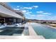 An infinity pool offers panoramic views and features in-pool lounge chairs at 801 Dragons Eye Dr, Henderson, NV 89012