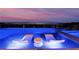 Stunning pool with lounge chairs and an attached jacuzzi offer a relaxing space with scenic city views at 801 Dragons Eye Dr, Henderson, NV 89012