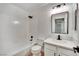 Bright bathroom with shower-tub combo and single sink vanity at 8024 Hurricane Cove Ct, Las Vegas, NV 89129