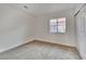 Neutral carpeted bedroom featuring a window and closet with sliding doors at 8024 Hurricane Cove Ct, Las Vegas, NV 89129