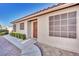 View of the entrance featuring a secure front door and gravel landscaping at 8024 Hurricane Cove Ct, Las Vegas, NV 89129