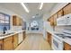 Bright kitchen with light wood cabinets, white counters, and updated appliances at 8024 Hurricane Cove Ct, Las Vegas, NV 89129