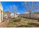 Spacious backyard with block wall fencing with sparse vegetation and trees at 8229 Willeta Ave, Las Vegas, NV 89145