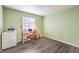 Bright bedroom with desk, chair, and view of outside through a window at 8229 Willeta Ave, Las Vegas, NV 89145