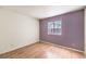 Bedroom featuring laminate flooring and window providing natural light at 8229 Willeta Ave, Las Vegas, NV 89145