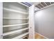 Walk-in closet features multiple white shelving units and provides ample storage at 8229 Willeta Ave, Las Vegas, NV 89145