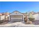 Charming single-Gathering home featuring a two-car garage and low-maintenance desert landscaping in the front yard at 8229 Willeta Ave, Las Vegas, NV 89145