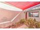 Cozy covered front porch with drought-tolerant landscaping, providing shade and curb appeal at 8229 Willeta Ave, Las Vegas, NV 89145