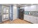 Traditional-style kitchen featuring white cabinets and a black refrigerator at 8229 Willeta Ave, Las Vegas, NV 89145