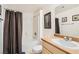 Well-lit bathroom with a shower-tub combo with tile surround and a vanity with solid surface countertops at 8250 N Grand Canyon Dr # 2102, Las Vegas, NV 89166