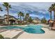 Beautiful outdoor pool with waterfall feature surrounded by lounge chairs and lush landscaping at 8250 N Grand Canyon Dr # 2102, Las Vegas, NV 89166