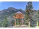 Charming Mt. Charleston Lodge and Cabins signage amidst a scenic mountain landscape, inviting visitors to explore at 8250 N Grand Canyon Dr # 2102, Las Vegas, NV 89166