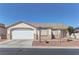 Charming single-story home featuring a two-car garage and low-maintenance landscaping at 832 Vineyard Vine Way, North Las Vegas, NV 89032