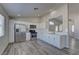 Modern kitchen featuring stainless steel appliances, white cabinets, and sleek countertops at 832 Vineyard Vine Way, North Las Vegas, NV 89032