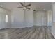 Open-concept living space with modern floors, neutral paint, and multiple entryways at 832 Vineyard Vine Way, North Las Vegas, NV 89032