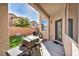 Back patio with a small grill and door leading to the interior at 854 Earth Luster Rd, Las Vegas, NV 89178