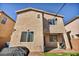 This backyard features a manicured lawn, brick pavers, and outdoor lighting, perfect for entertaining at 854 Earth Luster Rd, Las Vegas, NV 89178