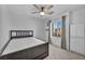 Well-lit bedroom with a dark wood bed frame, neutral carpet, and a window overlooking a lovely neighborhood view at 854 Earth Luster Rd, Las Vegas, NV 89178