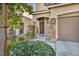 Inviting front entrance featuring stone accents, a covered porch, and a well-lit doorway at 854 Earth Luster Rd, Las Vegas, NV 89178