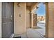 Charming front door with stone accents and a covered porch at 854 Earth Luster Rd, Las Vegas, NV 89178