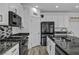 Granite countertops, stainless steel appliances, and a stylish backsplash highlight this modern kitchen at 854 Earth Luster Rd, Las Vegas, NV 89178