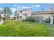 A well-manicured backyard with lush green grass and mature landscaping at 8701 Robinson Ridge Dr, Las Vegas, NV 89117