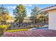 Beautiful backyard features a private pool, putting green, golf course, and blue skies at 8701 Robinson Ridge Dr, Las Vegas, NV 89117